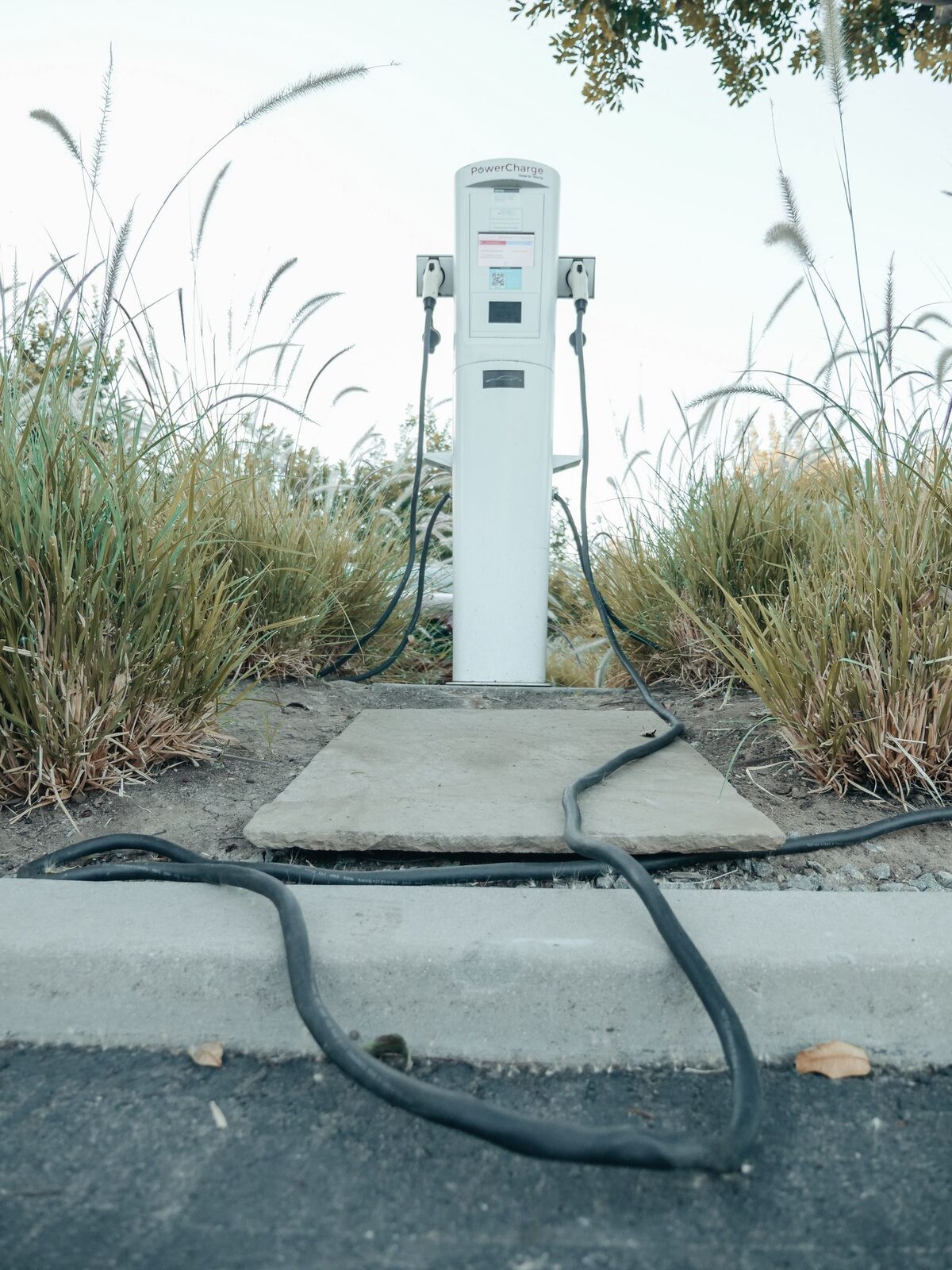 An EV charge point being maintained by a Safer Charging specialist